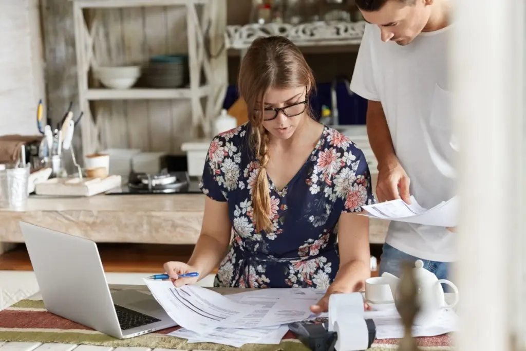 woman in glasses reviewing payment documents