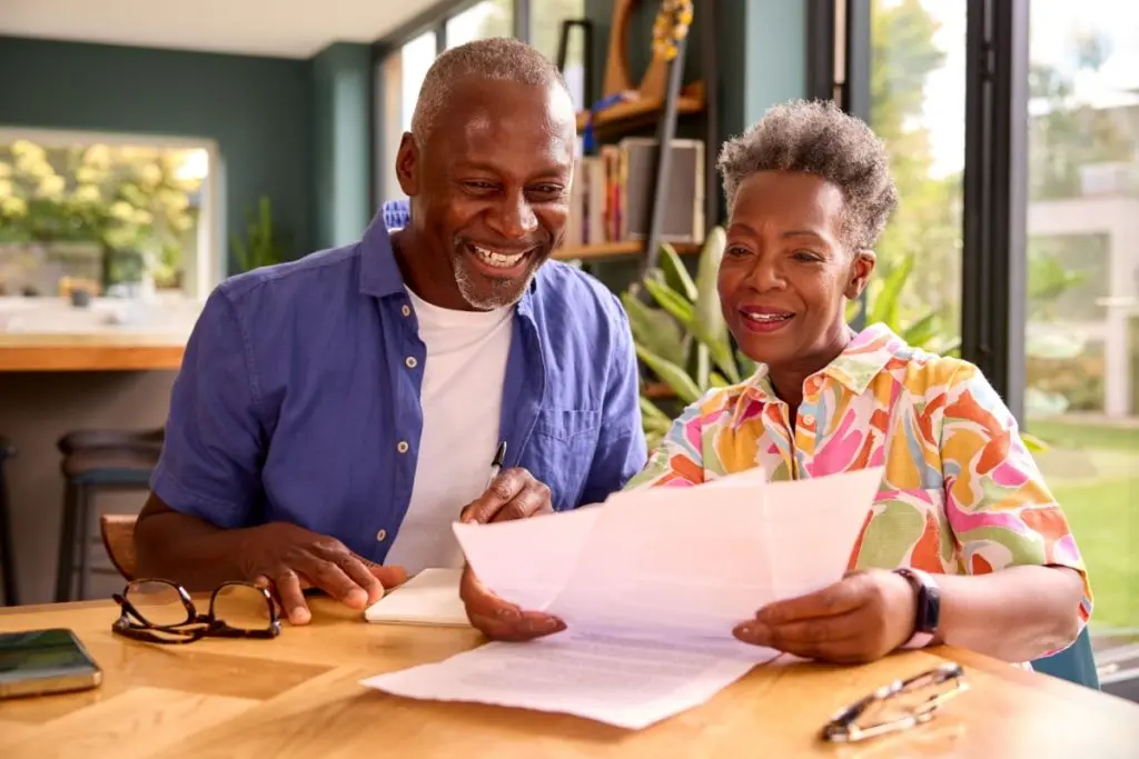 people signing loan agreement