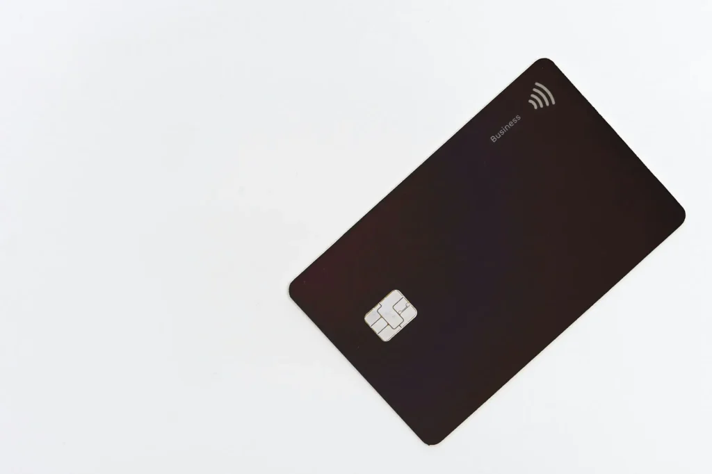 black credit card on white surface