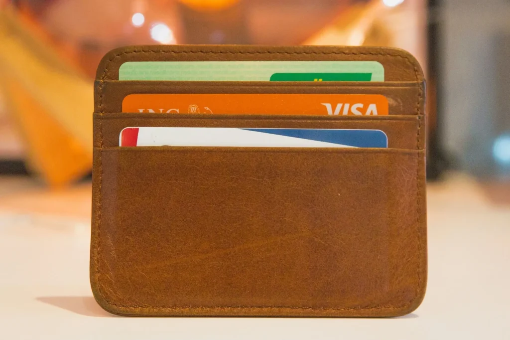 brown wallet with credit cards