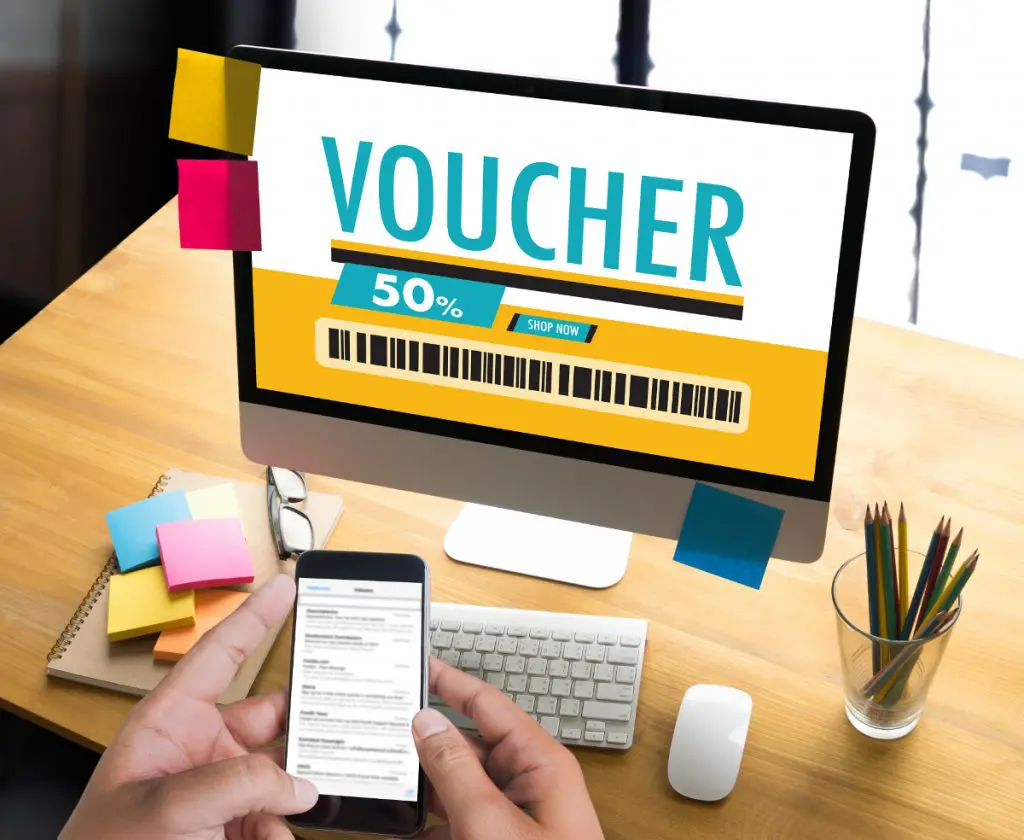 laptop with image of a voucher online