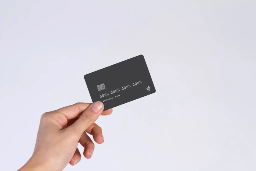 hand holding black credit card