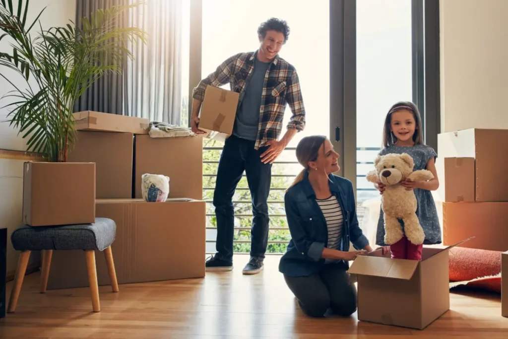 family unpacking boxes