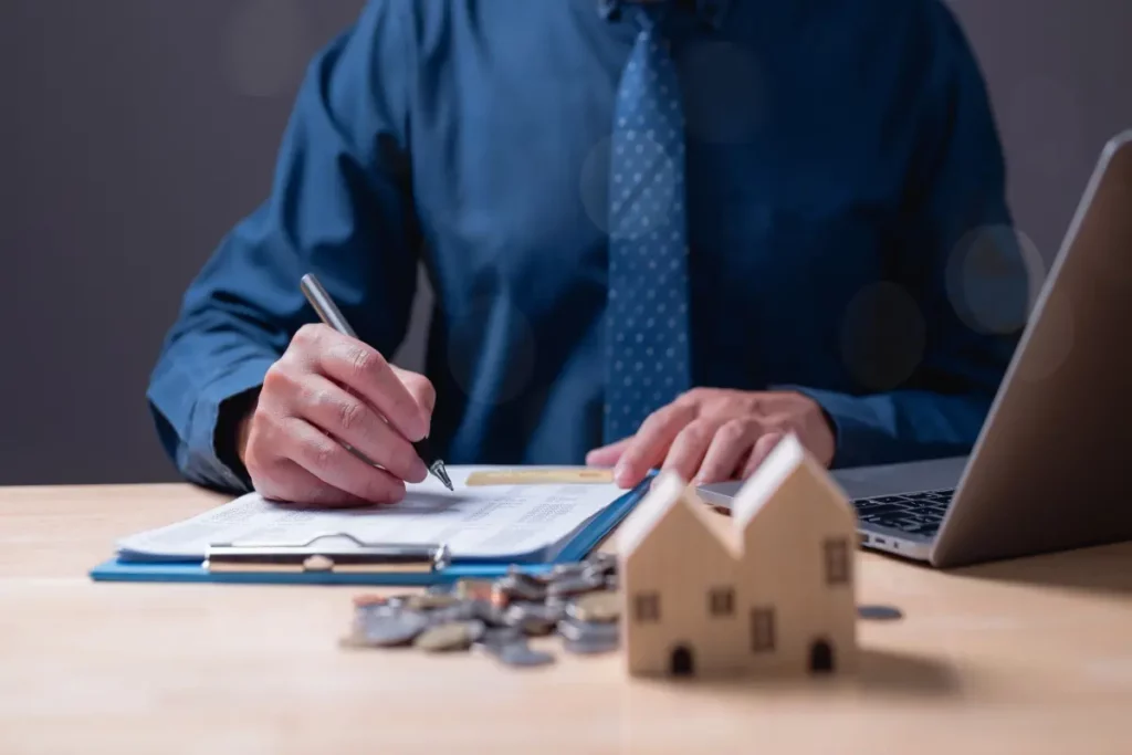 man signing mortgage papers