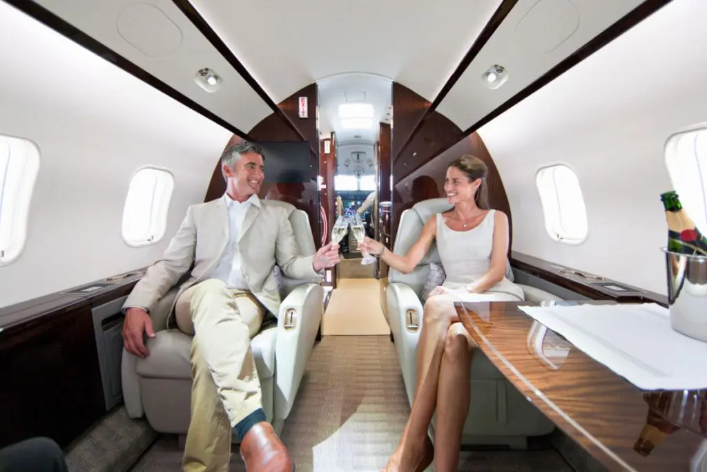 Couple enjoying private jet