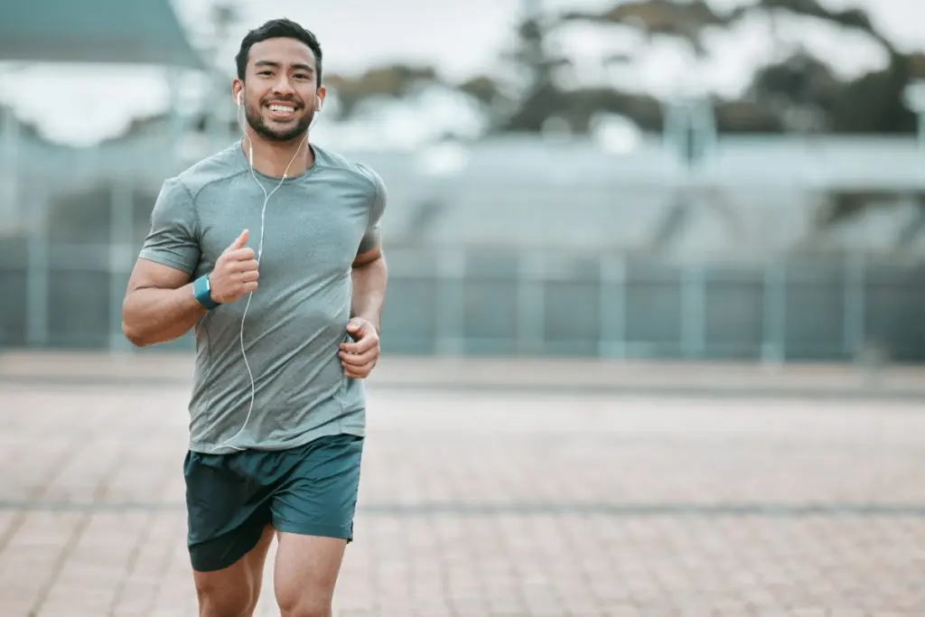 Man running to burn off junk food calories