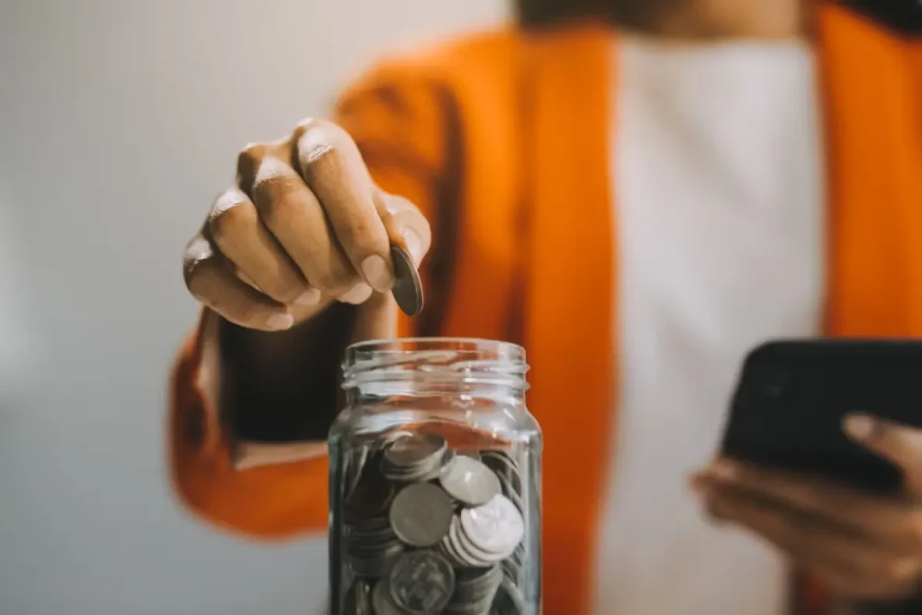 putting coins in a jar