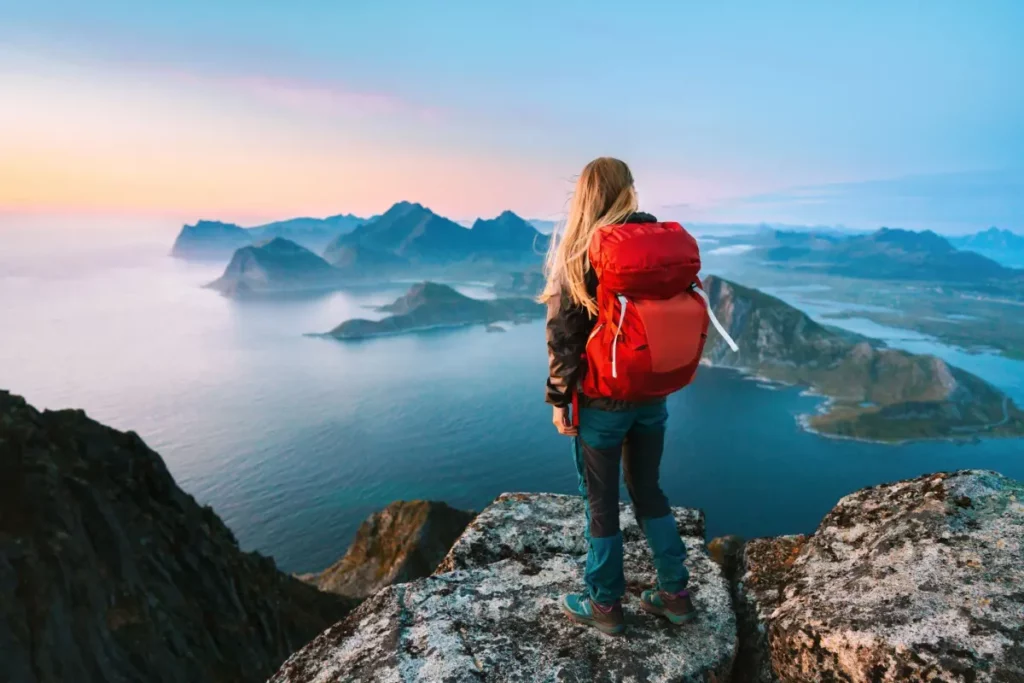 woman looking out onto mountain range