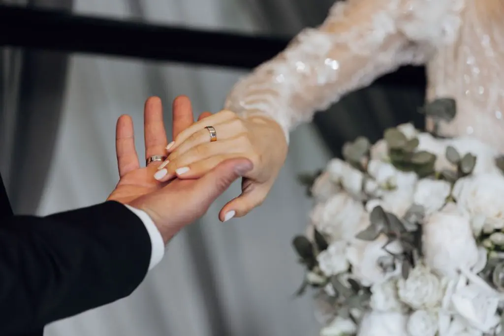 bride and groom holding hands